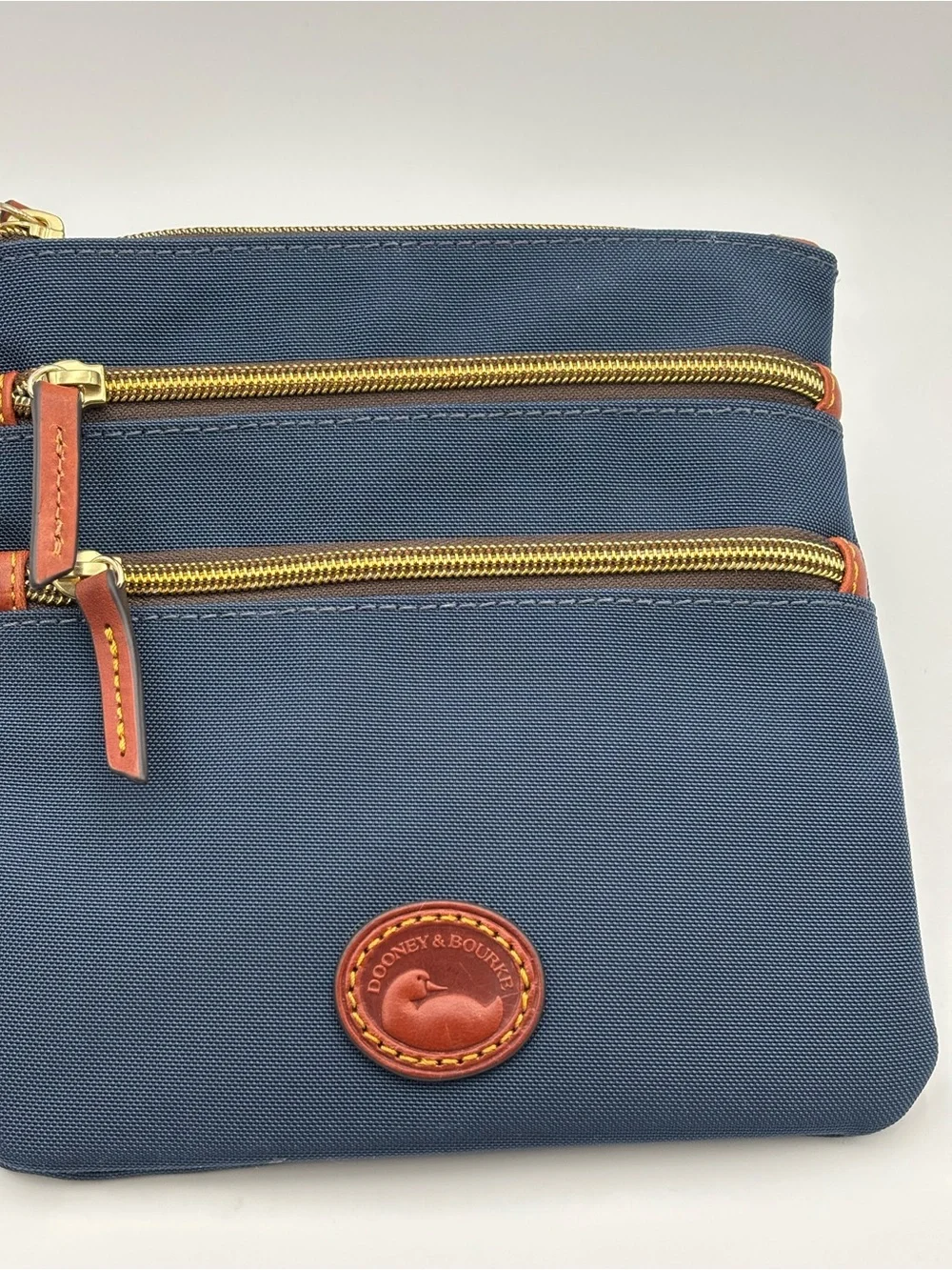 Dooney & Bourke Triple Zip Navy Crossbody with Brown Leather Trim